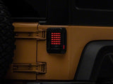 Raxiom J115435 - FITS: 07-18 Jeep Wrangler JK LED Tail Lights- Black Housing (Smoked Lens)